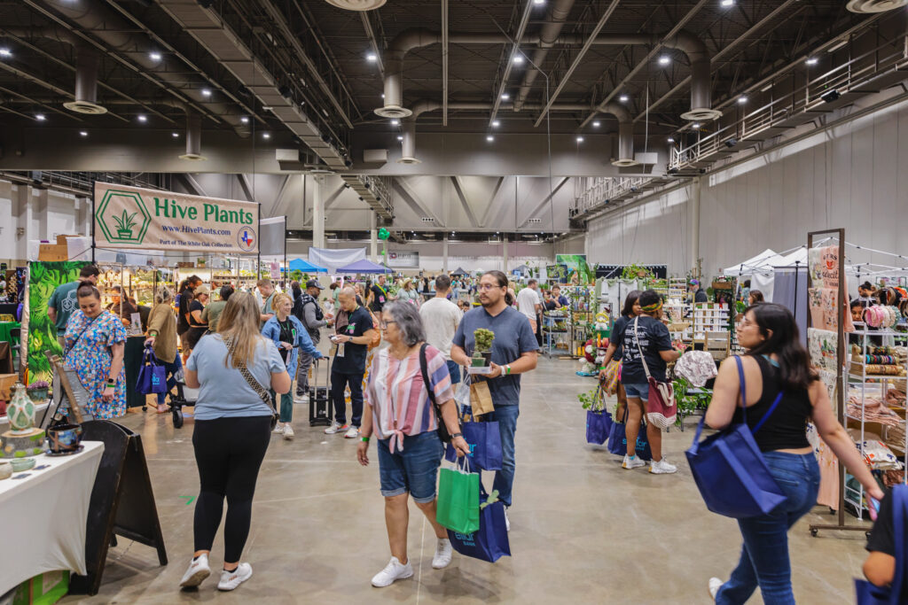 People milling about booths at PlantCon