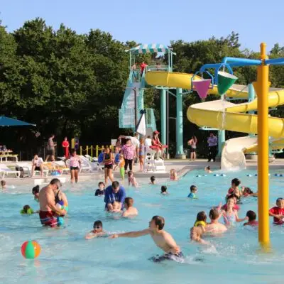 Kids swimming and splashing at public pool