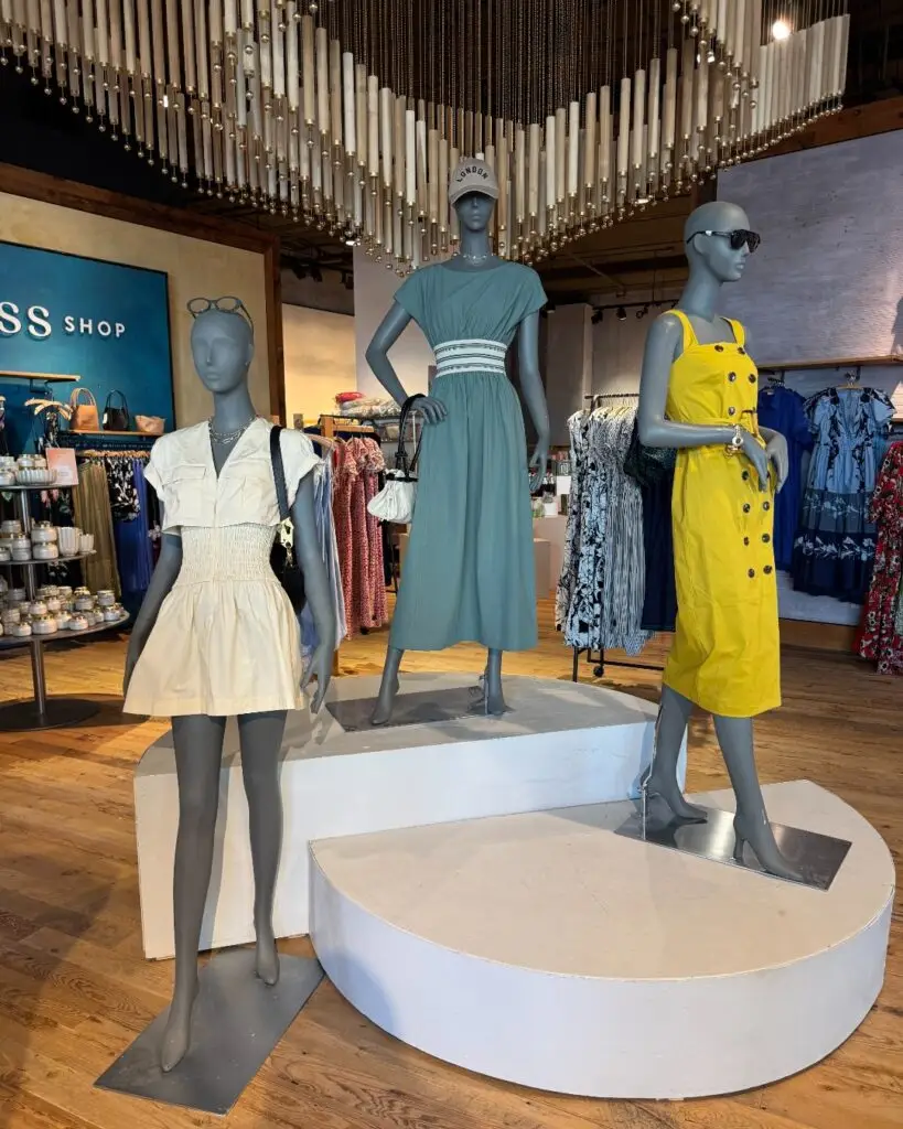 Mannequins displaying seasonal fashion inside Anthropologie at Watters Creek Village in Allen, Texas.