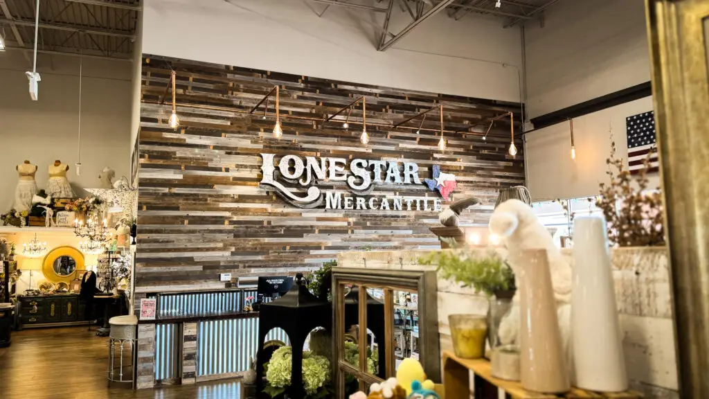 Rustic wood accent wall featuring Lone Star Mercantile signage inside the Allen, Texas marketplace.