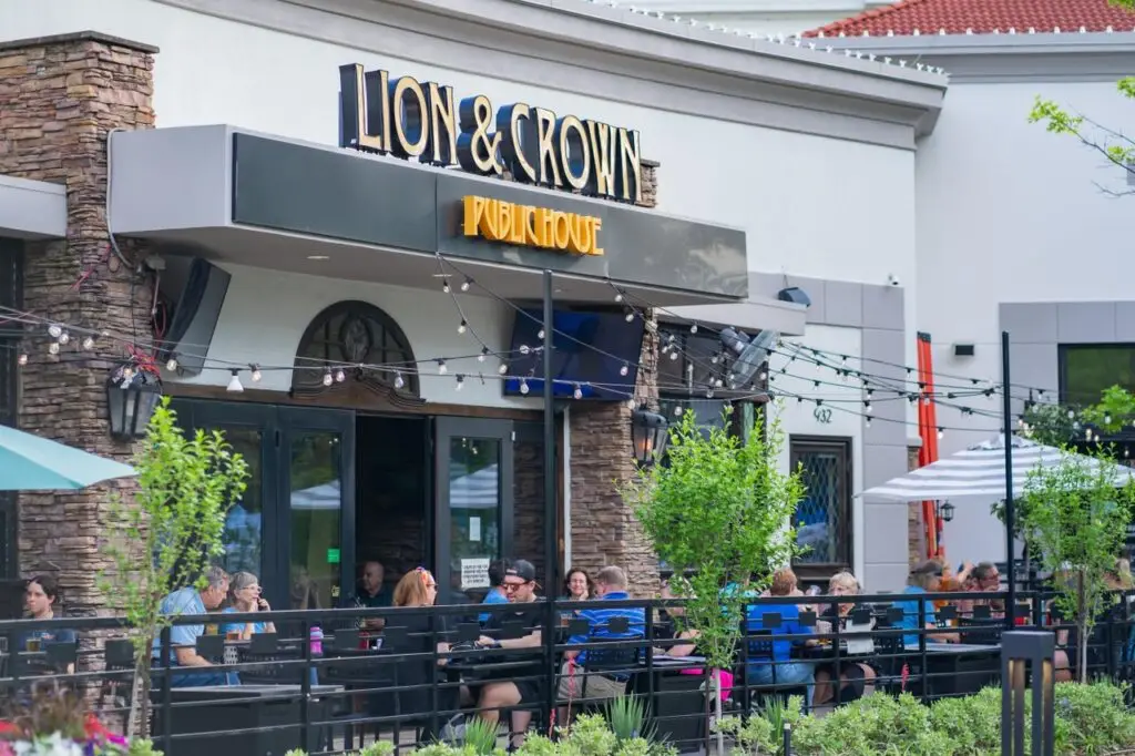 Outdoor patio seating at Lion and Crown Public House at Watters Creek Village in Allen, Texas.