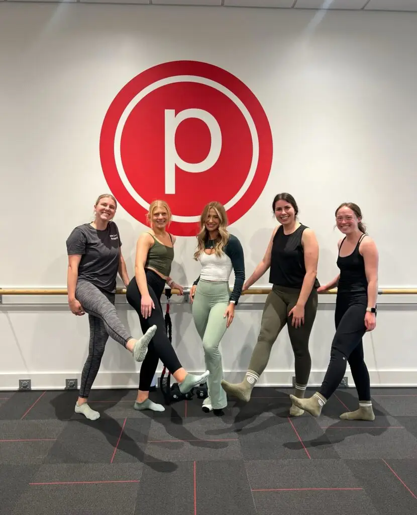 Group of five participants smiles after a Pure Barre class at Pure Barre Allen in Allen, Texas.