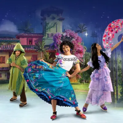 Disney On Ice performers dressed as characters from Encanto and Wish skate in front of a colorful nighttime backdrop for Magic in the Stars at Credit Union of Texas Event Center in Allen, Texas.